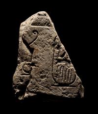 An Egyptian Limestone Relief Fragment with Cartouche of Ramesses II