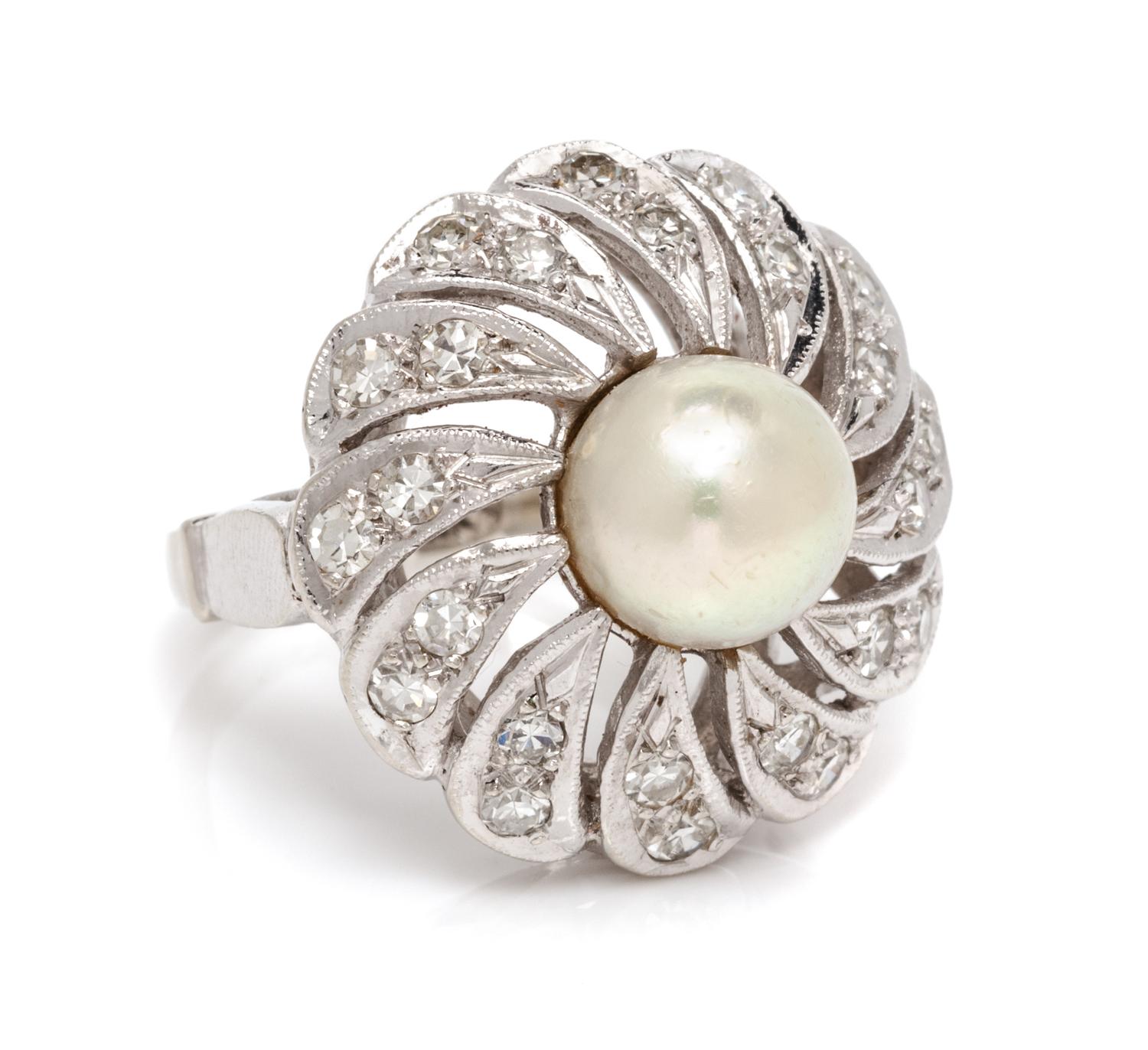 A 14 Karat White Gold, Cultured Pearl and Diamond Ring, 6.20 dwts.