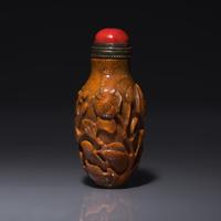 A Chinese Bird and Flower-Carved Root Amber Snuff Bottle 琥珀雕花鳥鼻烟壺