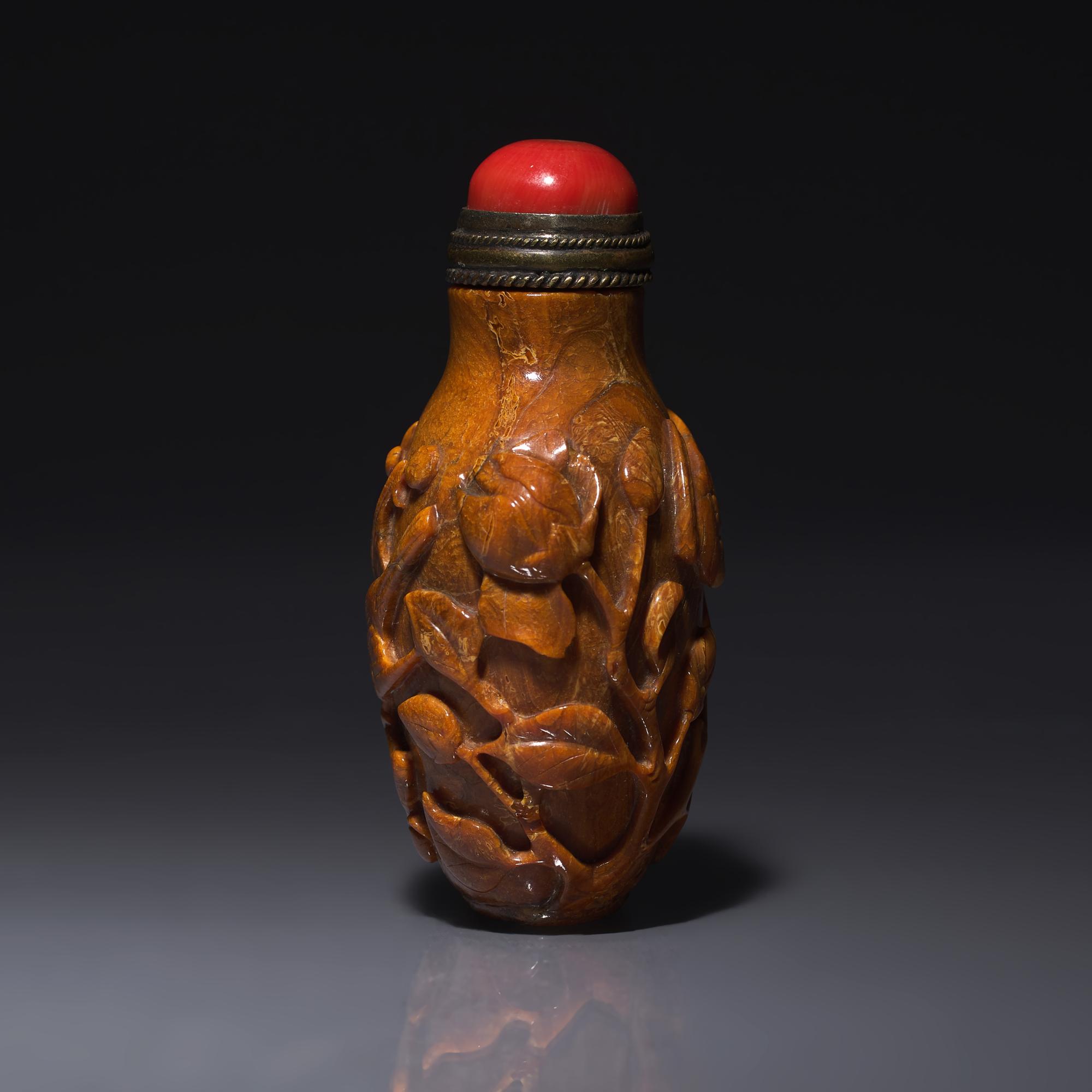 A Chinese Bird and Flower-Carved Root Amber Snuff Bottle 琥珀雕花鳥鼻烟壺