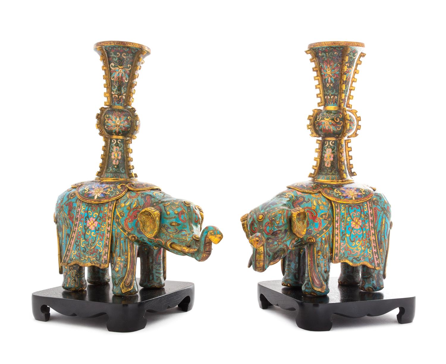 A Pair of Cloisonne Enamel Elephant-Form Candle Holders Height of each figure 11 inches.