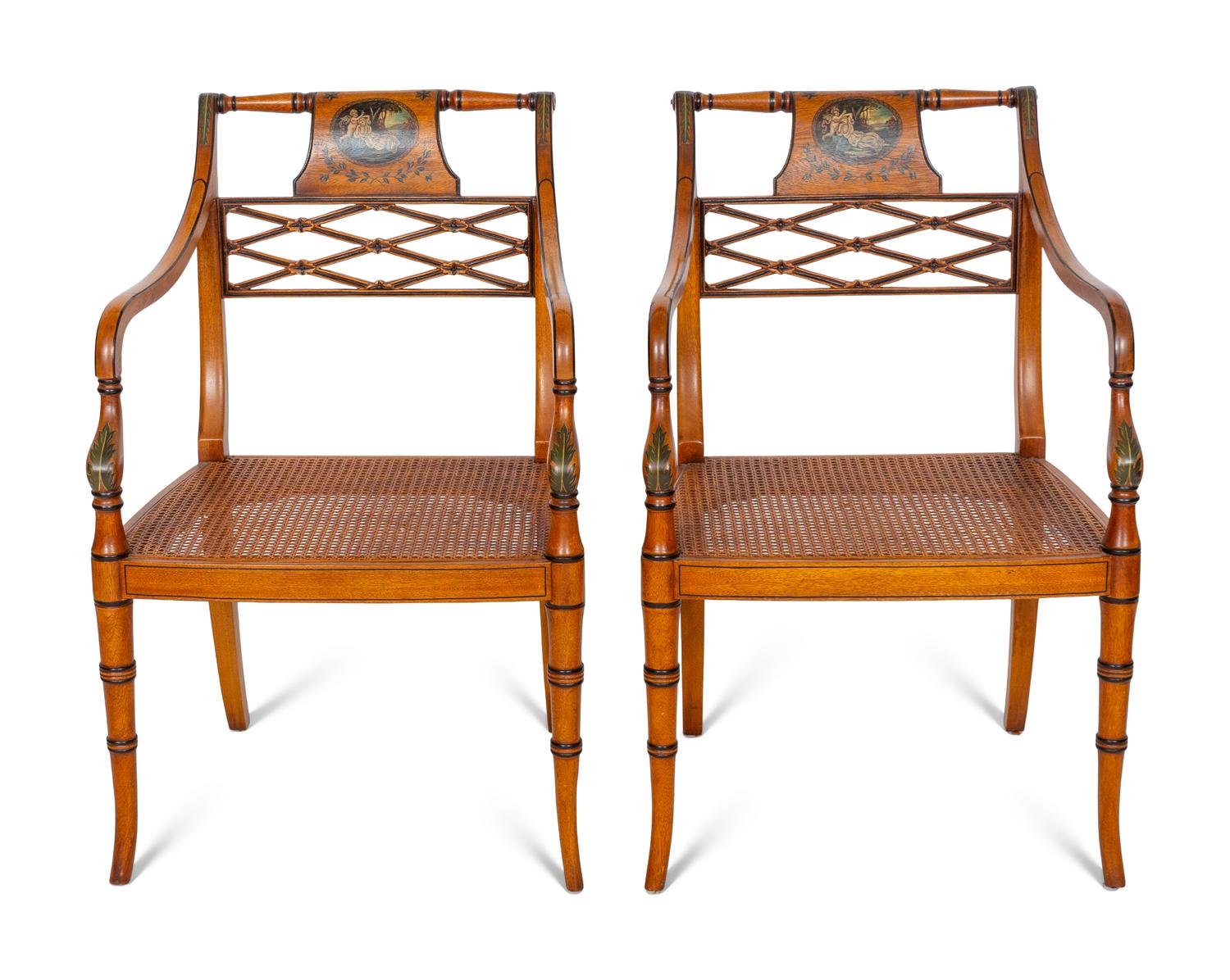 A Pair of Regency Style Paint Decorated and Parcel Ebonized Armchairs