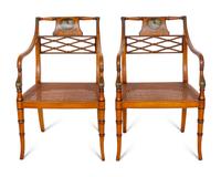 A Pair of Regency Style Paint Decorated and Parcel Ebonized Armchairs