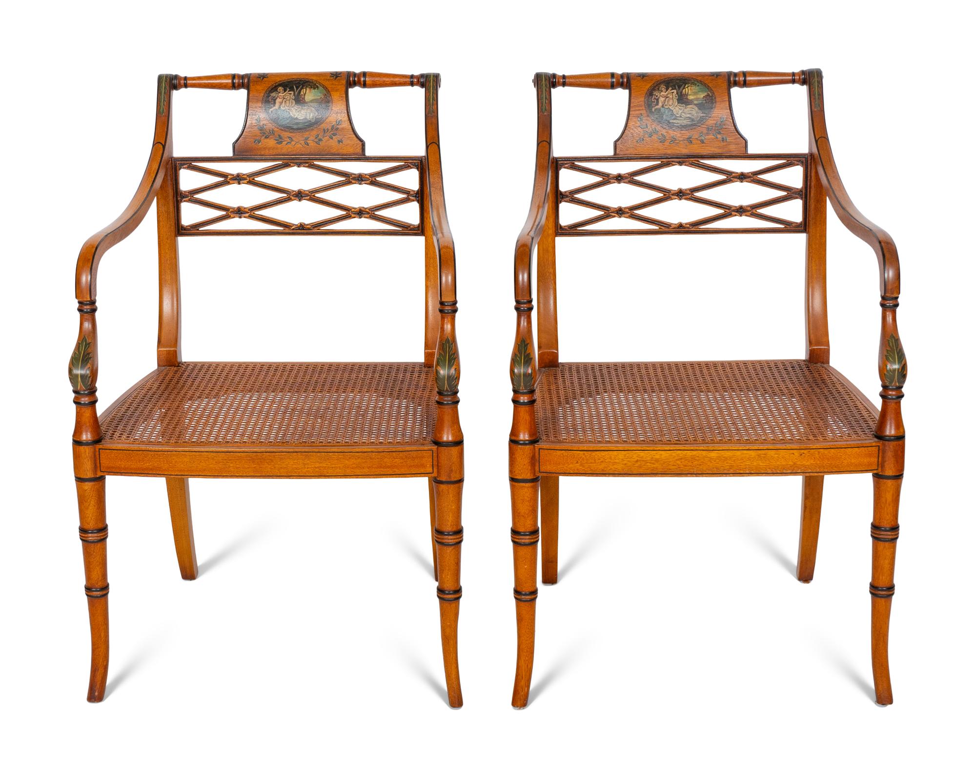 A Pair of Regency Style Paint Decorated and Parcel Ebonized Armchairs