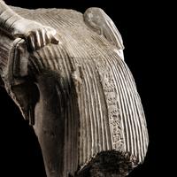 An Egyptian Limestone Fragment of a Seated Scribe
