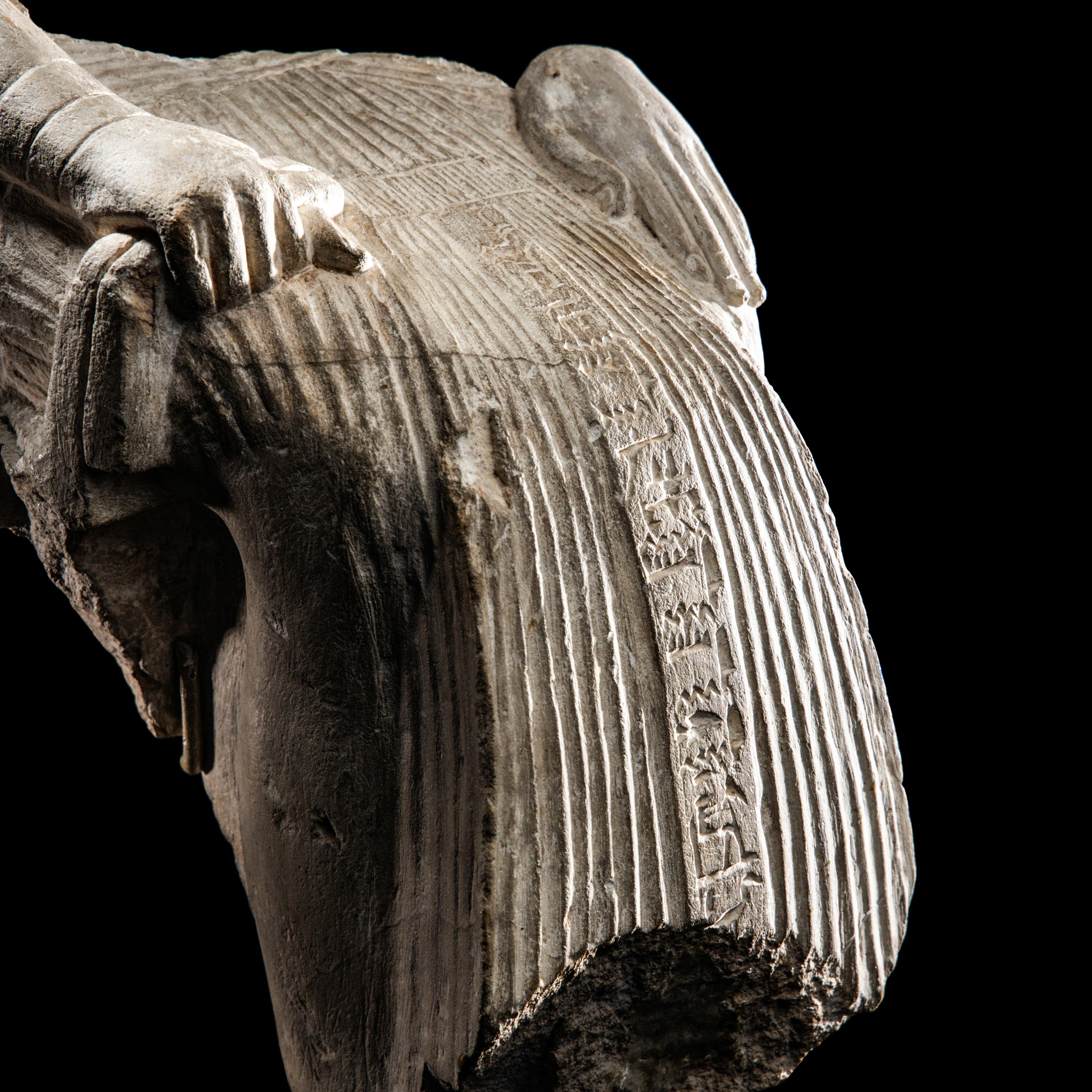 An Egyptian Limestone Fragment of a Seated Scribe