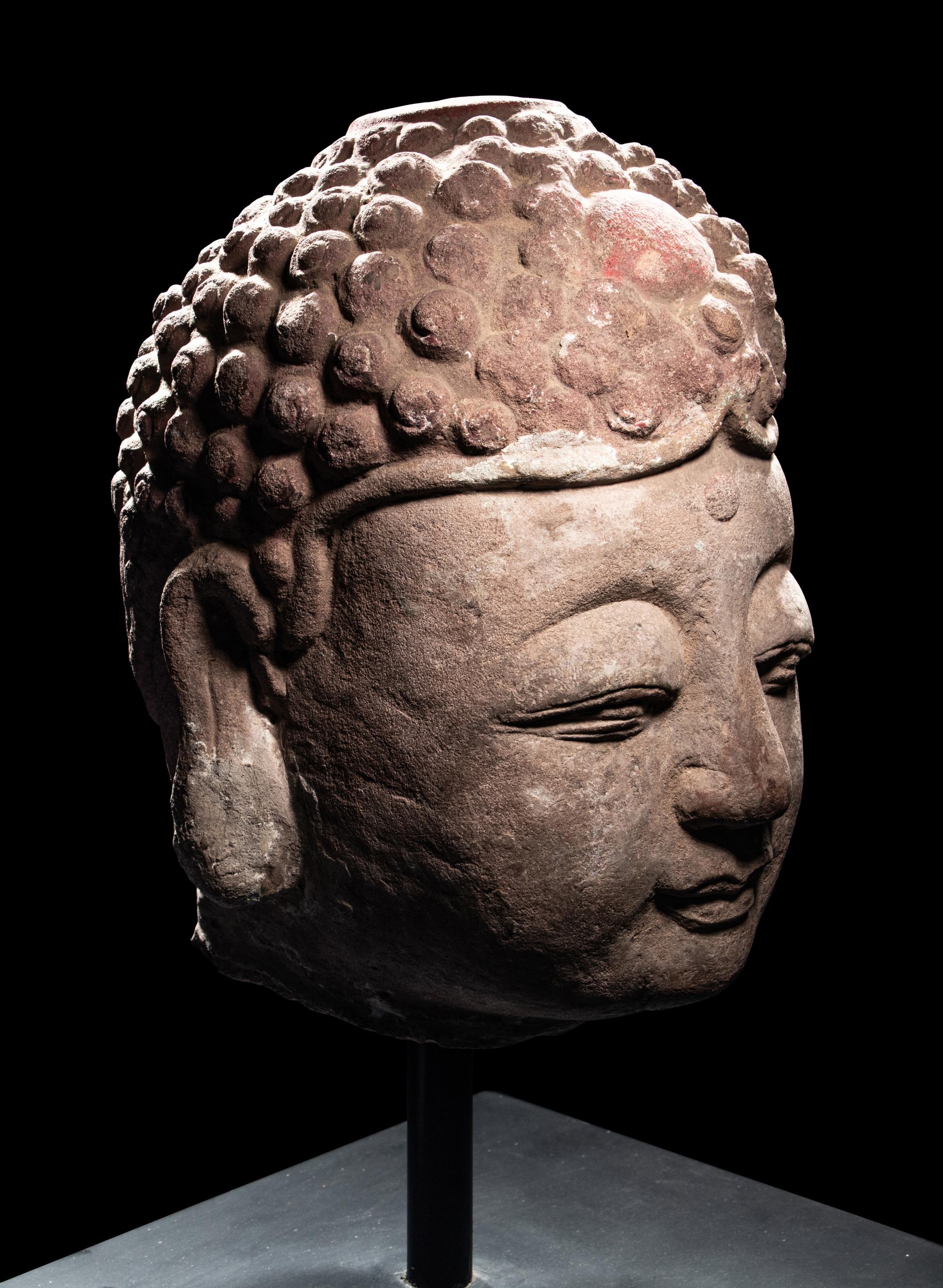 A Pair of Chinese Carved Stone Heads of Buddha