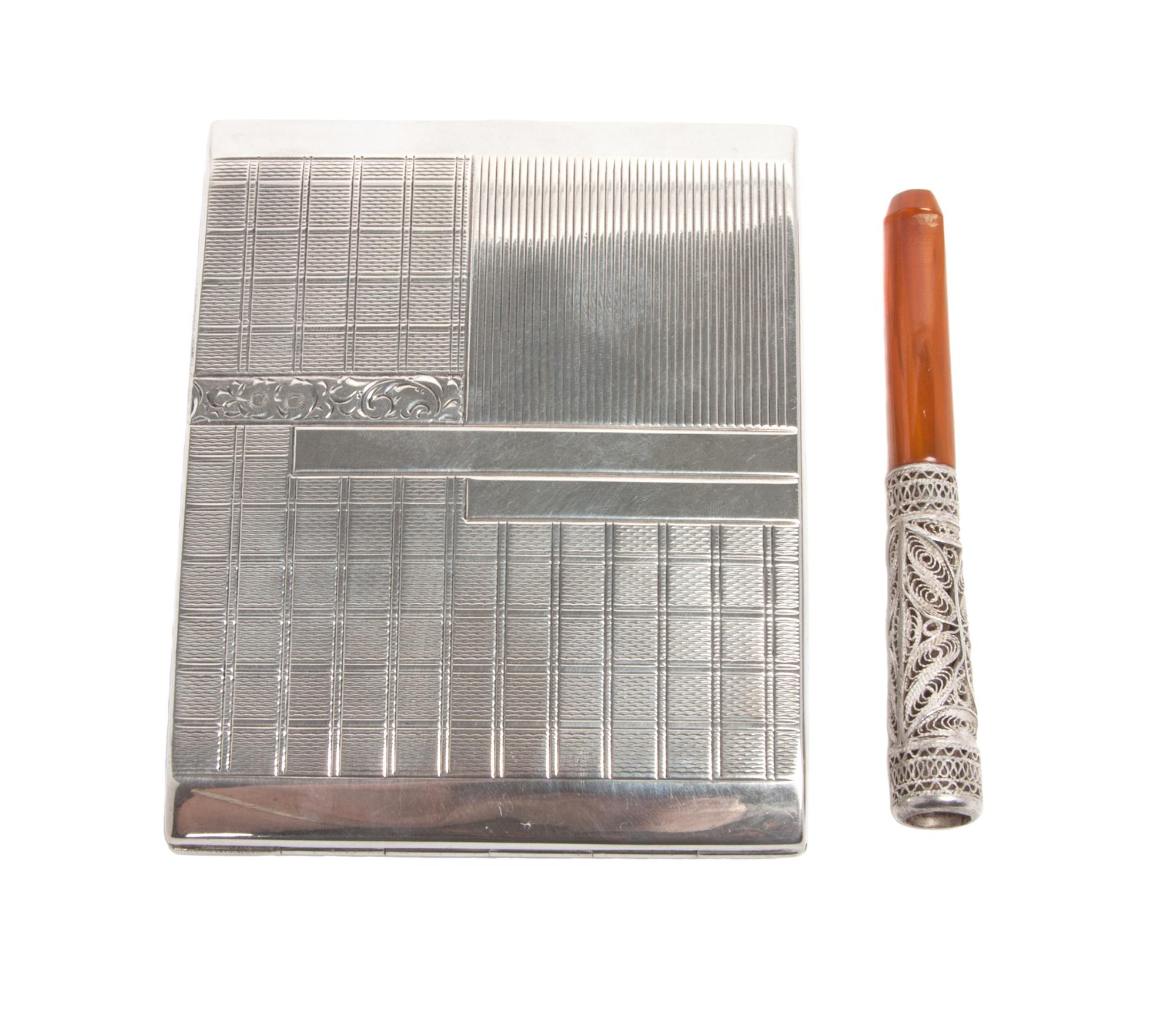 A Continental Silver Cigarette Case, 20th Century, of rectangular form, together with a silver filigree cigarette holder.