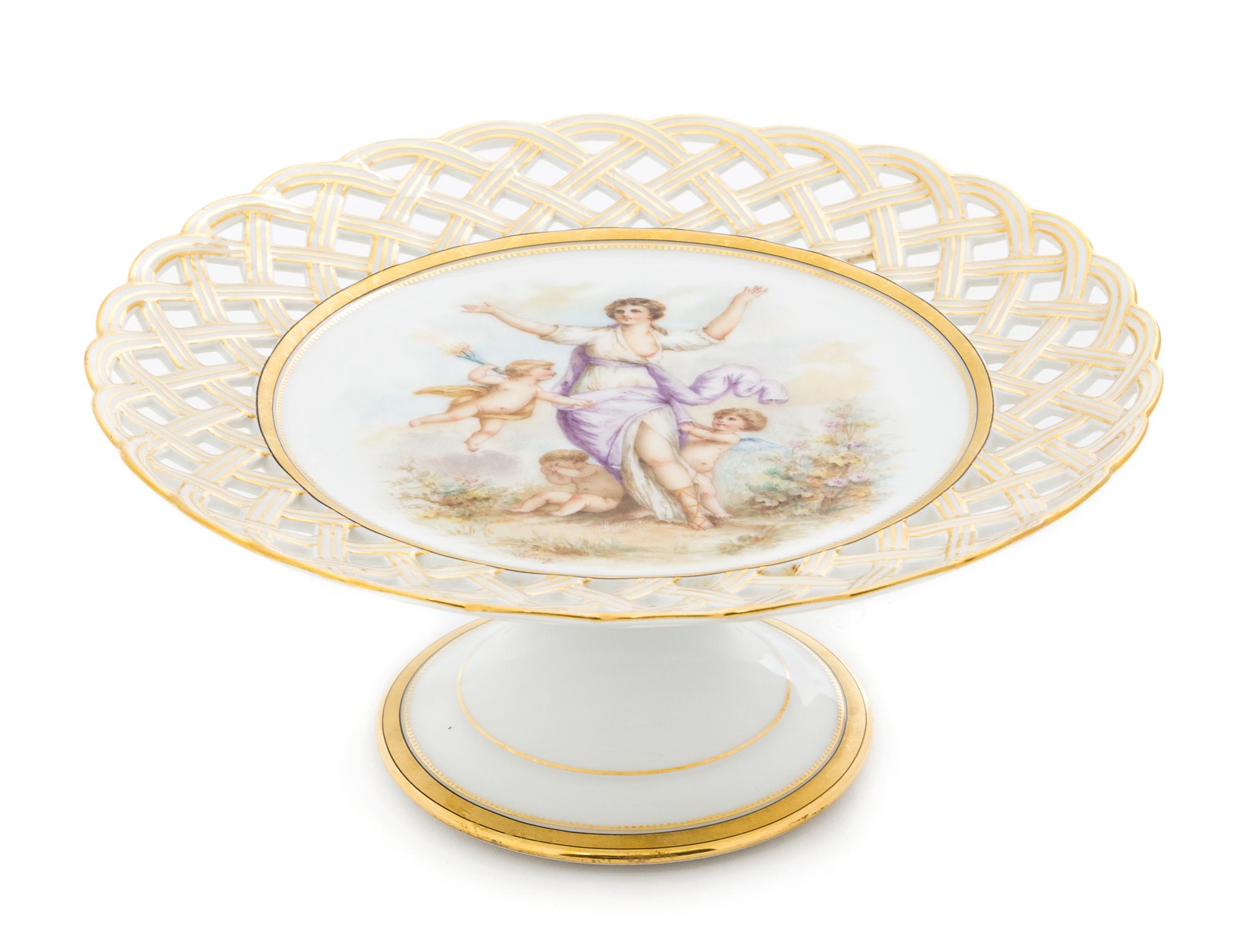 A Continental Porcelain Cake Stand Diameter 9 inches.