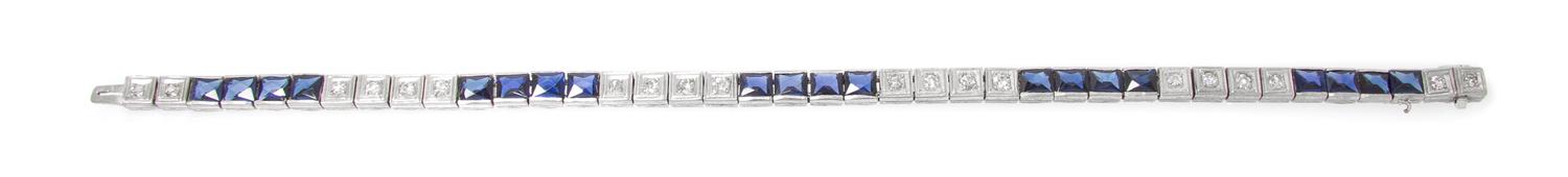 A Platinum, Diamond and Synthetic Sapphire Bracelet, 7.30 dwts.