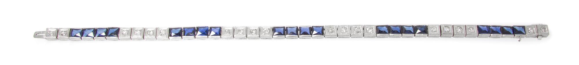 A Platinum, Diamond and Synthetic Sapphire Bracelet, 7.30 dwts.