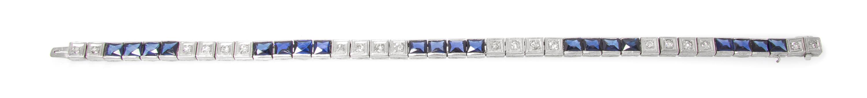 A Platinum, Diamond and Synthetic Sapphire Bracelet, 7.30 dwts.