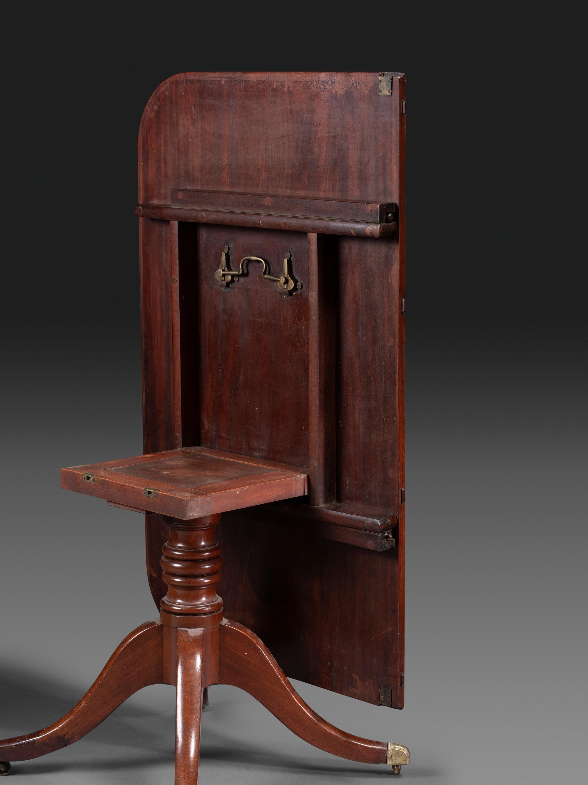 A Federal Mahogany Double Pedestal Extension Dining Table