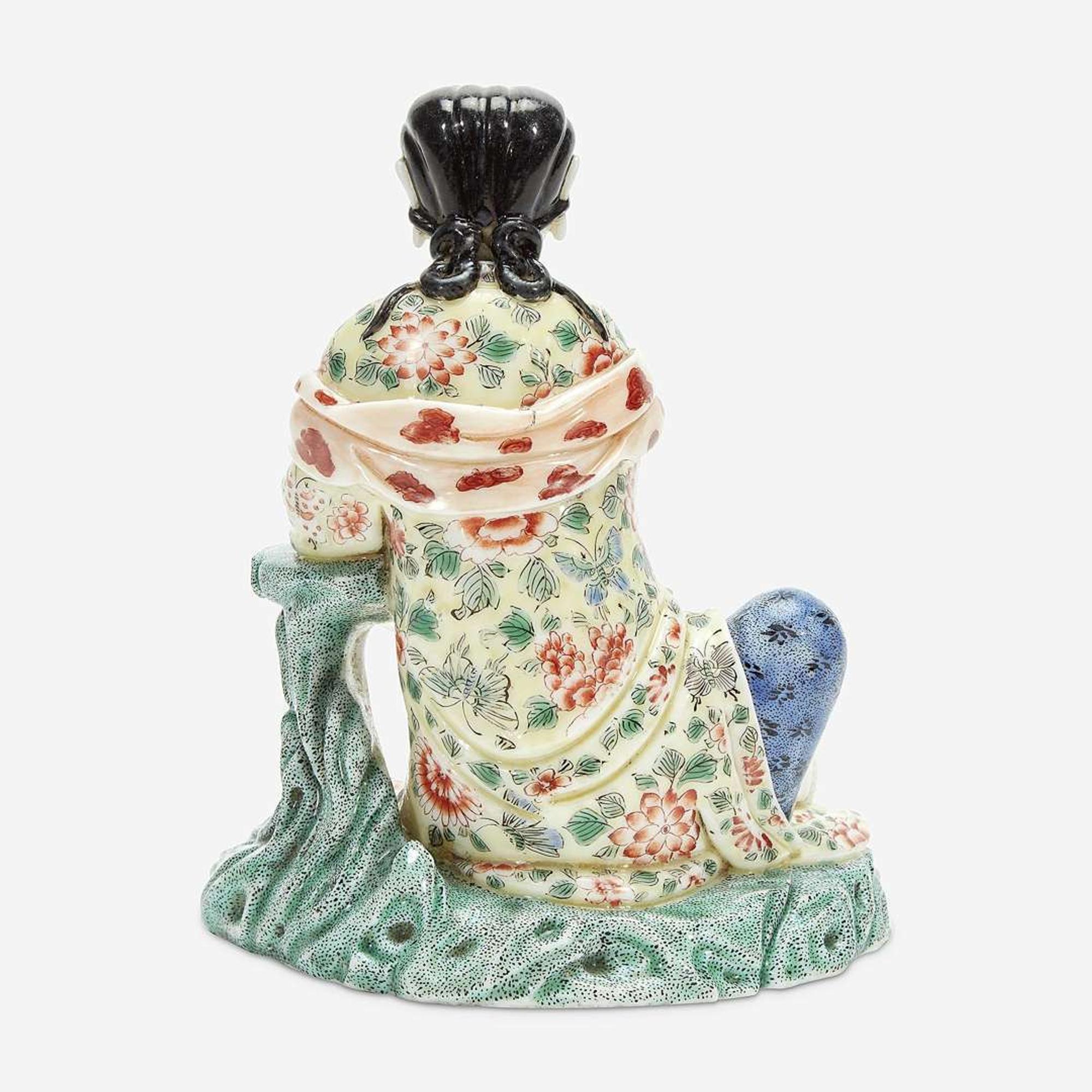 A Chinese enameled Dehua porcelain figure of Guanyin seated 18th Century, later decorated
