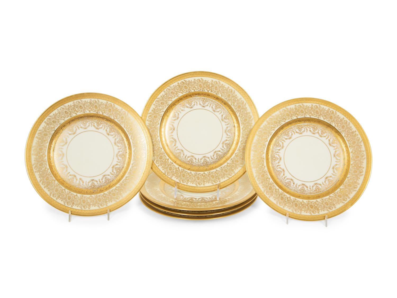 A Set of Twelve Heinrich and Co. Gilt Decorated Porcelain Dinner Plates