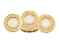 A Set of Twelve Heinrich and Co. Gilt Decorated Porcelain Dinner Plates