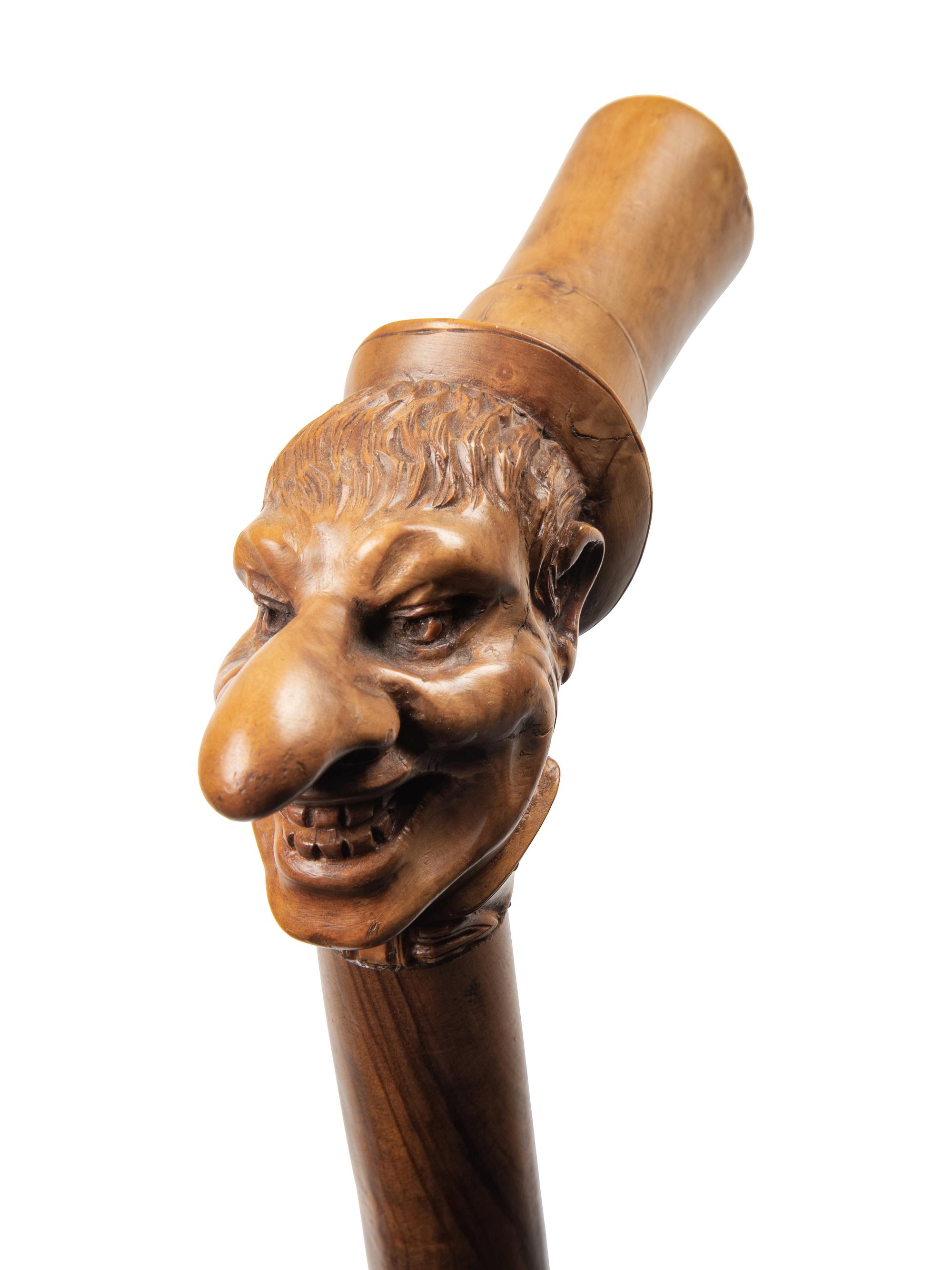 Three Continental Carved Wood Figural Canes
