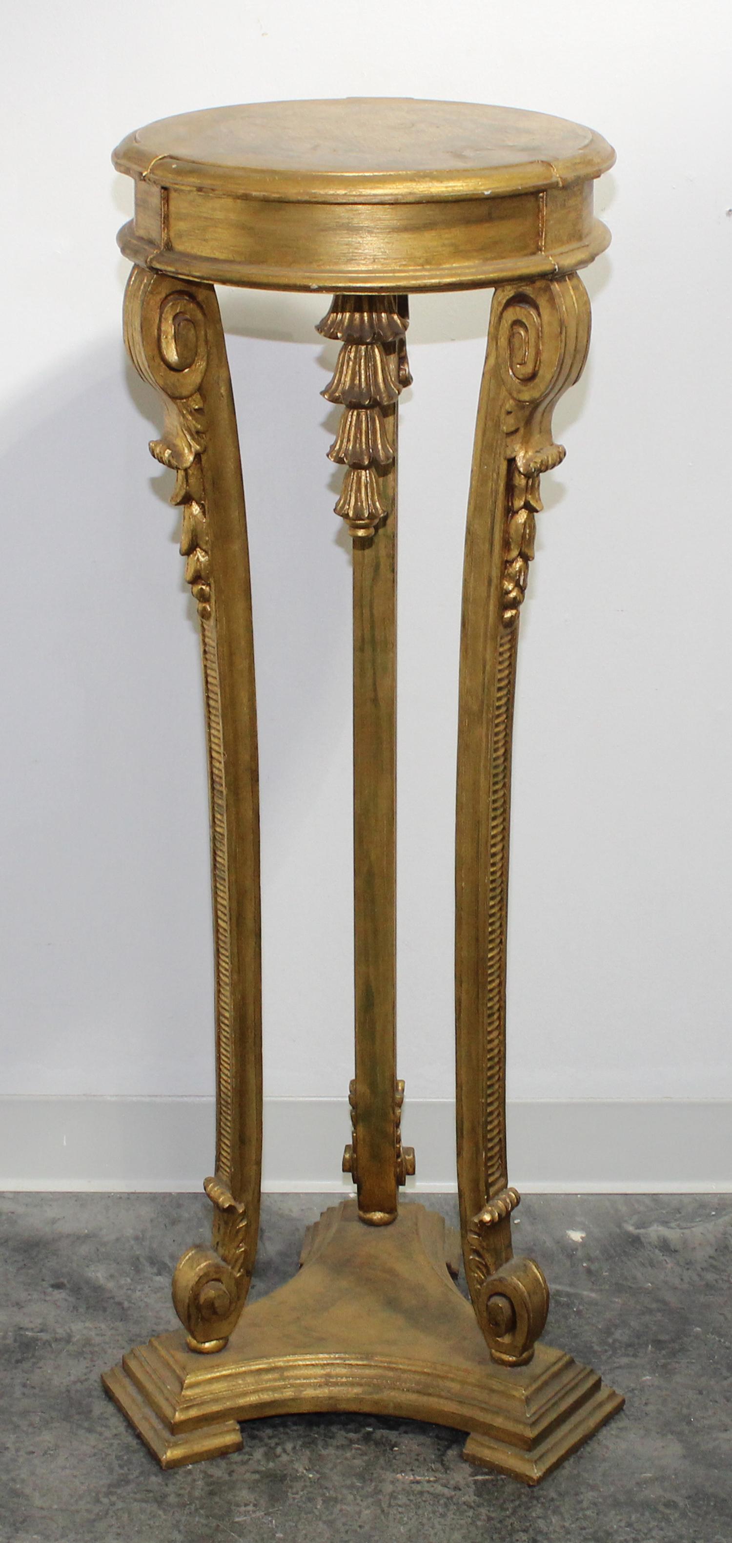 A Neoclassical Giltwood Pedestal. Height 43 3/4 inches.