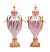 A Pair of Sèvres Style Gilt Bronze Mounted Porcelain Urns