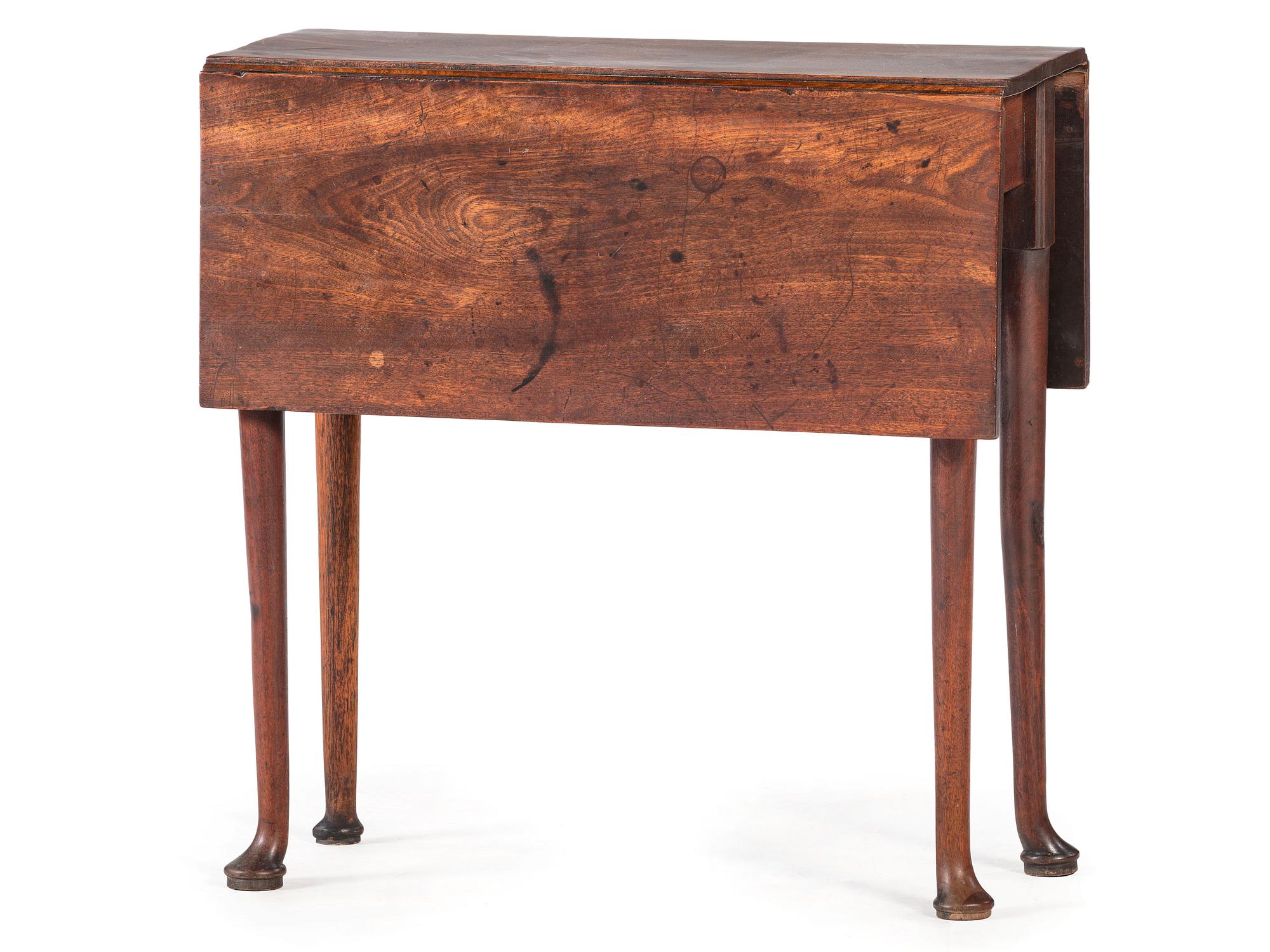 A George III Figured Mahogany Pad-Foot Drop-Leaf Table