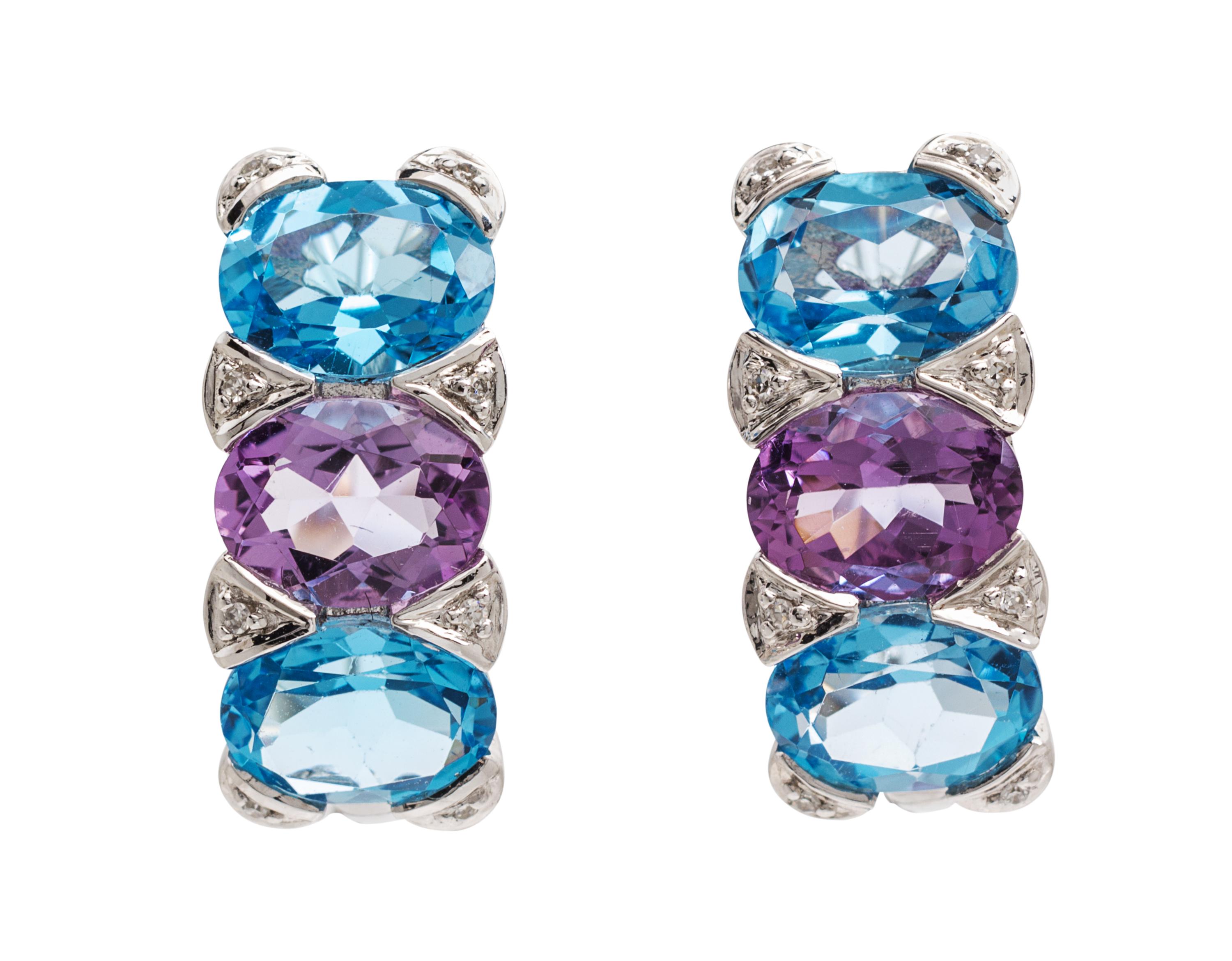 A Pair of 14 Karat White Gold, Blue Topaz, Amethyst and Diamond Earclips, 5.40 dwts.