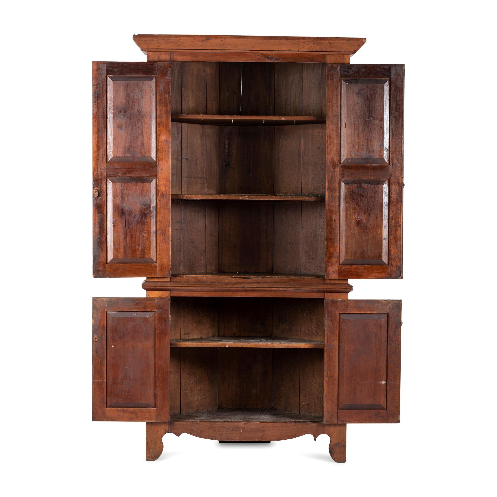 A Chippendale Paneled Cherrywood Corner Cupboard