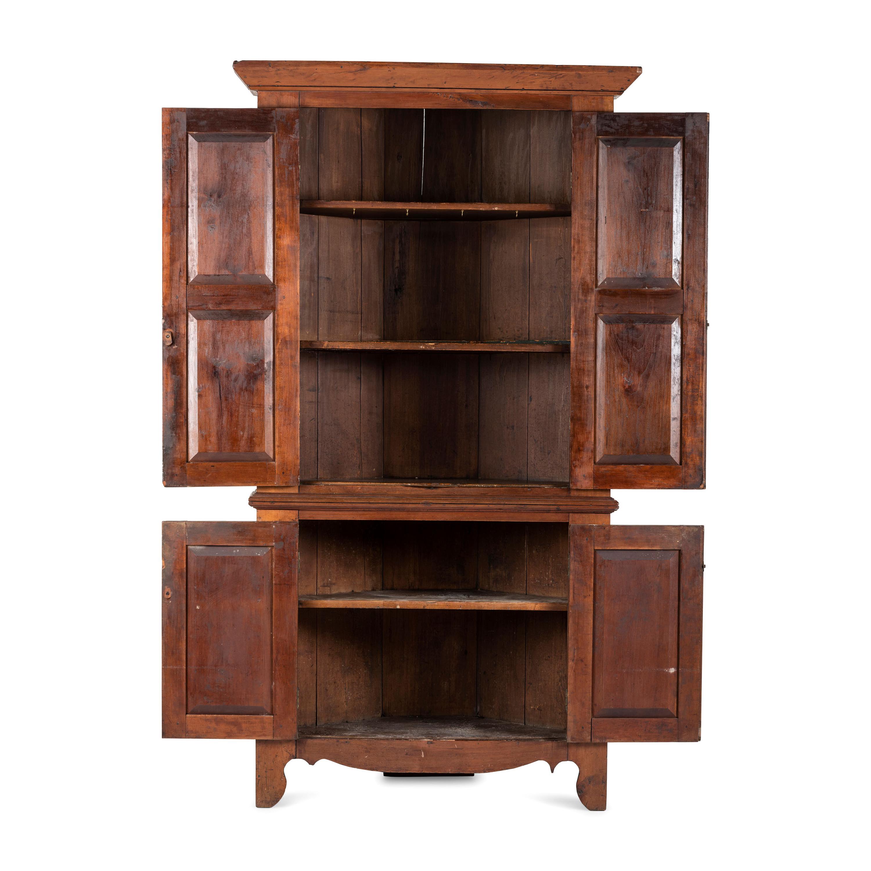 A Chippendale Paneled Cherrywood Corner Cupboard