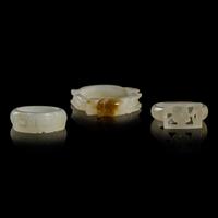 Nine Chinese Pale Celadon Jade Loop-Form Pendants and Three Rings, 20th Century — 近代 青白玉連環一組九件及戒指三枚