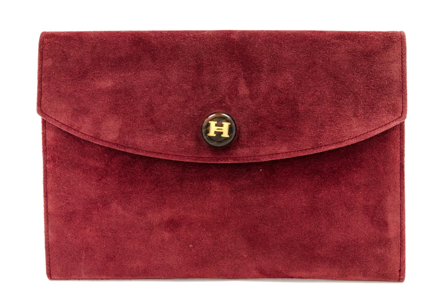 An Hermes Burgundy Suede Rio Clutch, 9 1/2 x 6 1/2 x 1 inches.