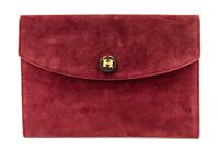 An Hermes Burgundy Suede Rio Clutch, 9 1/2 x 6 1/2 x 1 inches.