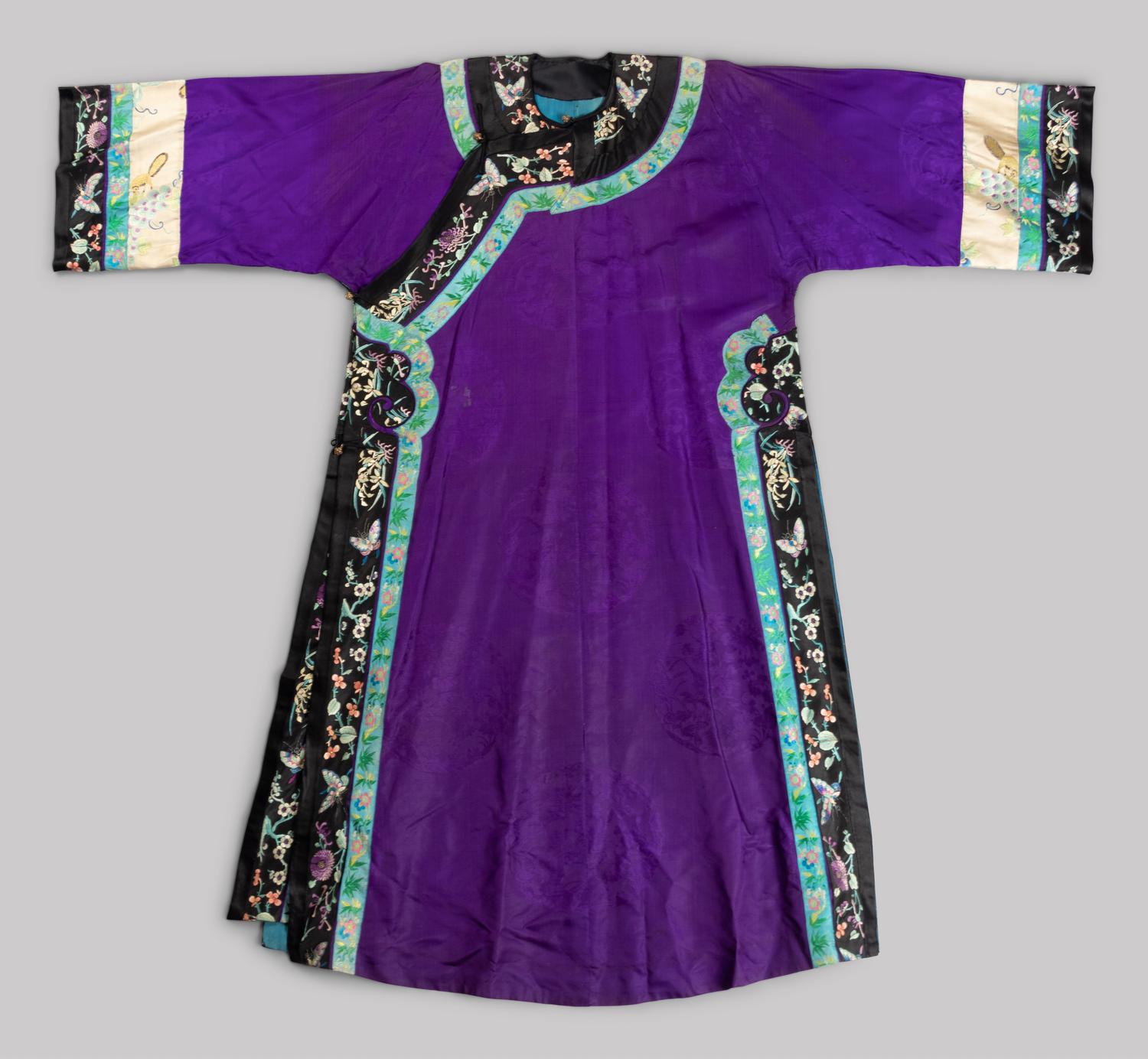 A Chinese Embroidered Silk Manchu Ladies' Robe