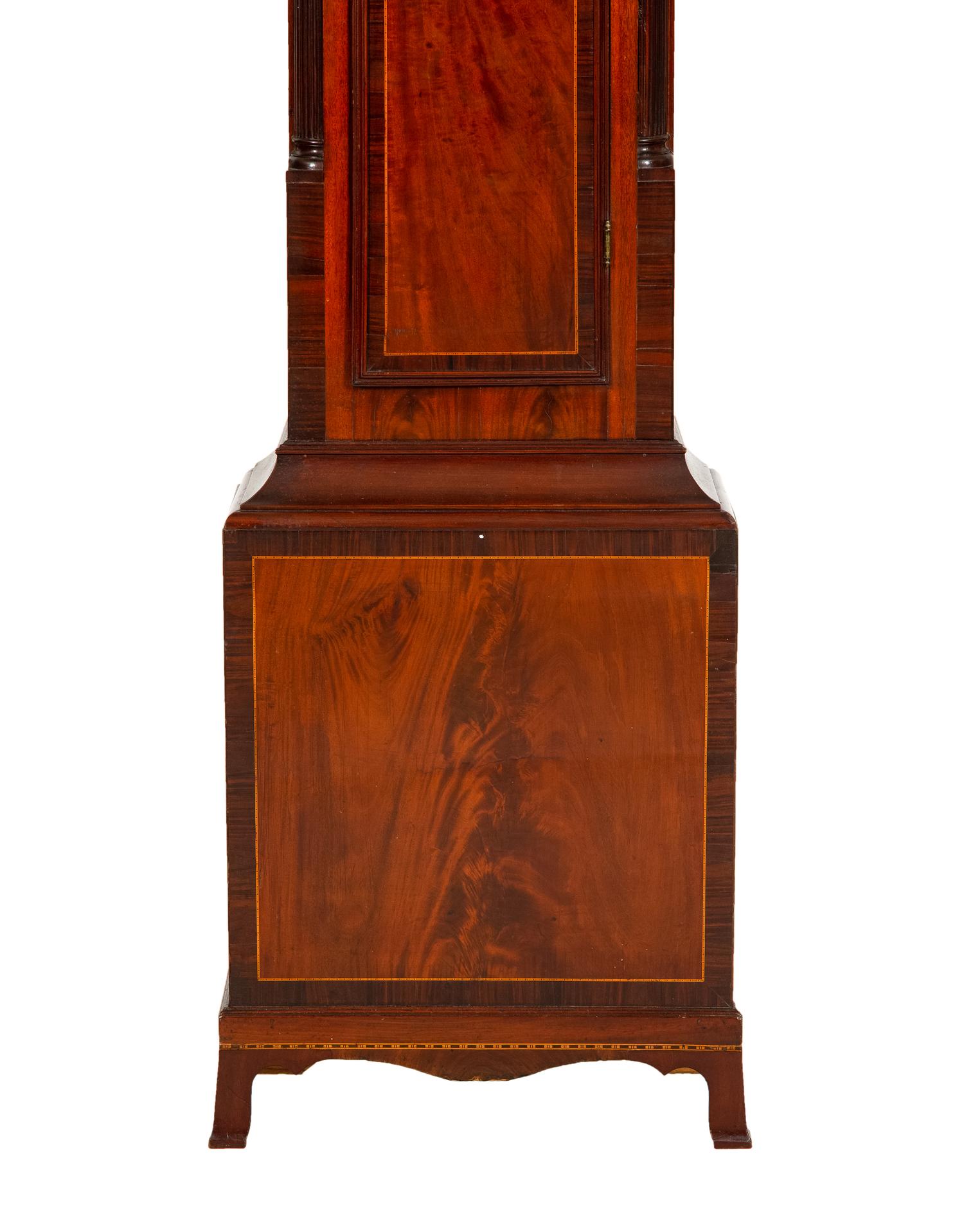 A Federal Carved, Inlaid and Figured Mahogany Tall Case Clock