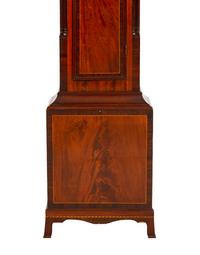 A Federal Carved, Inlaid and Figured Mahogany Tall Case Clock