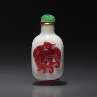 A Chinese Glass Overlay "Dragon and Phoenix" Snuff Bottle, Qing Dynasty, 18th Century — 清中期 涅白地套雙色料龍鳳紋鼻煙壺