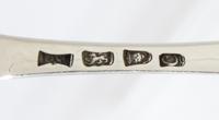 A Pair of George III Silver Tablespoons, possibly Jas. Stamp, London, 1778, the handle with an engraved crest of an arm embowed with ar