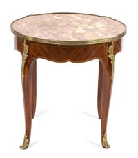 A Louis XV Style Marble Top Gilt Metal Mounted Table Height 22 1/2 x diameter 23 1/4 inches. — 19TH CENTURY