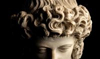 A Roman Marble Head of a Triton