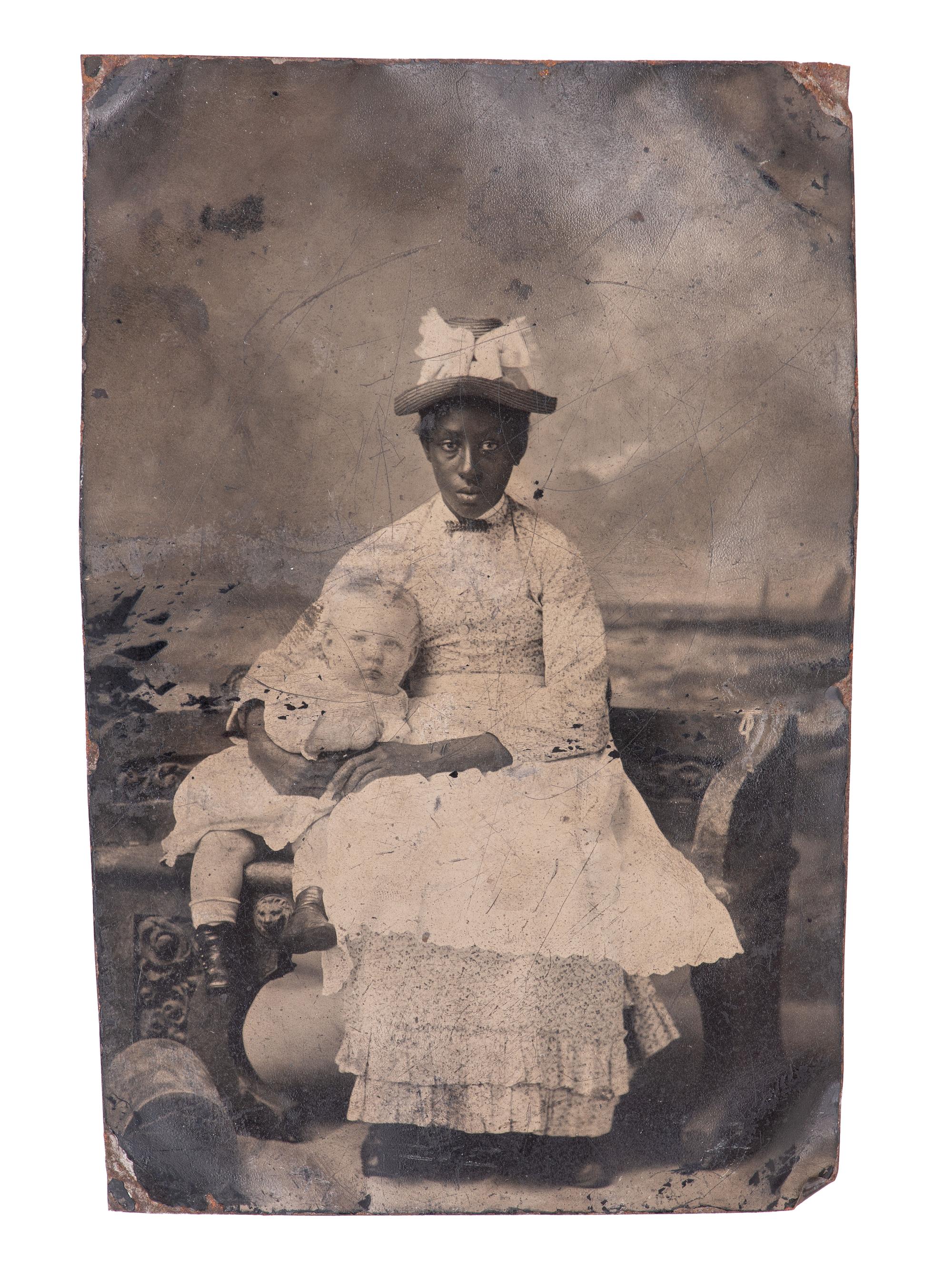 [EARLY PHOTOGRAPHY]. 7 tintypes of African American subjects, incl. caretaker with white child.