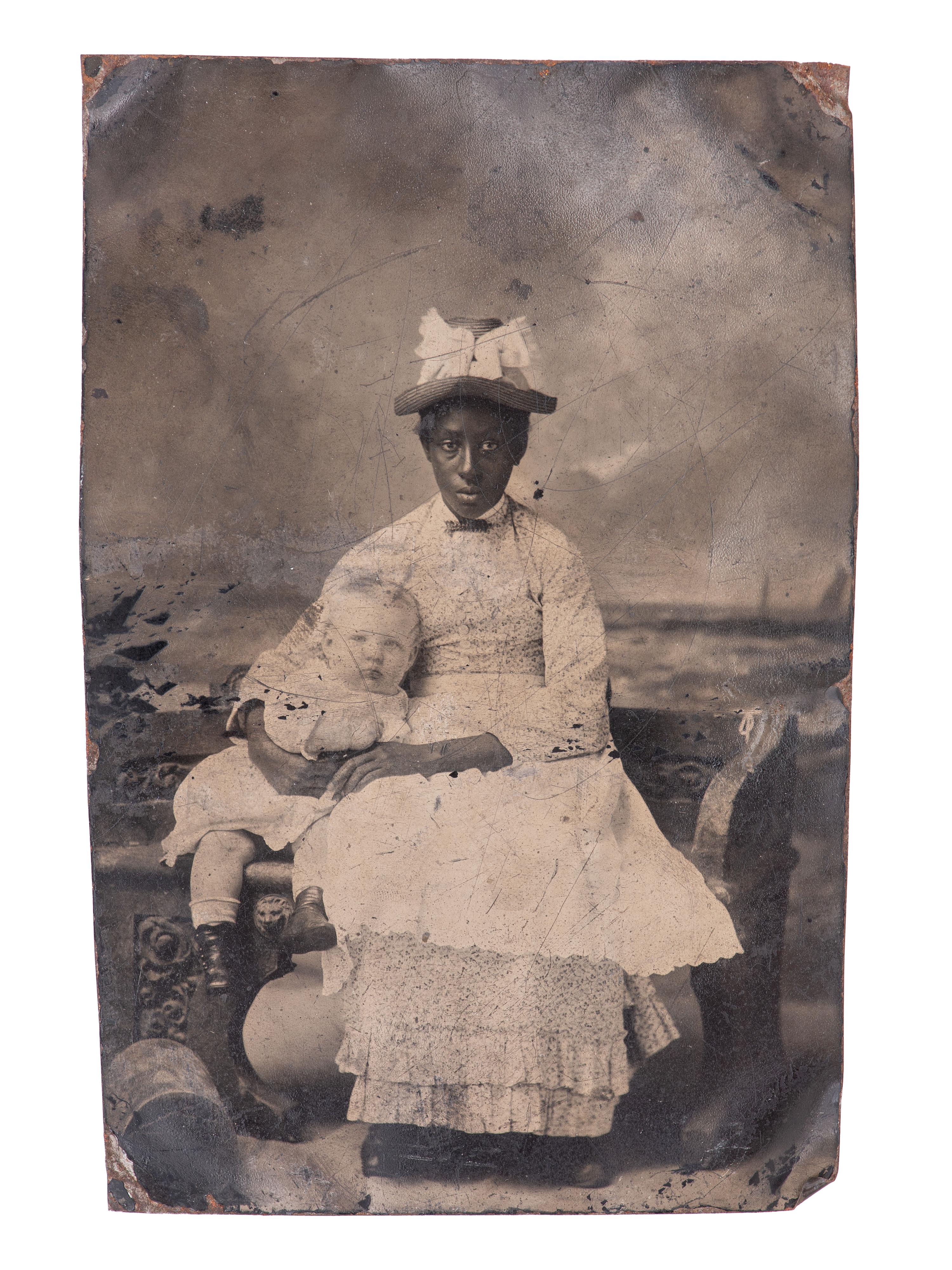 [EARLY PHOTOGRAPHY]. 7 tintypes of African American subjects, incl. caretaker with white child.