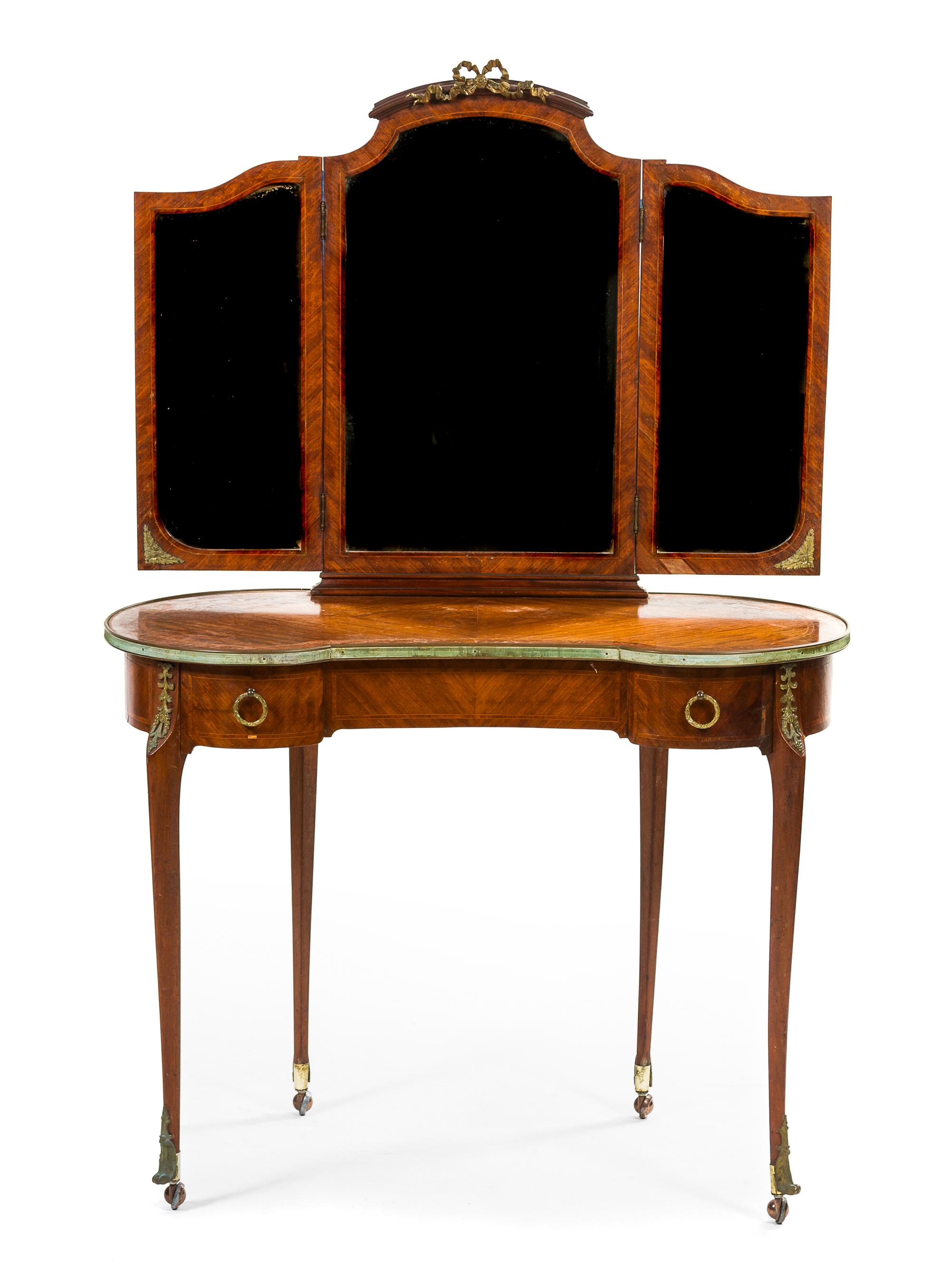 A Louis XVI Style Mahogany and Gilt Metal Mounted Dressing Table, Height 62 x width 39 1/2 x depth 20 1/2 inches.