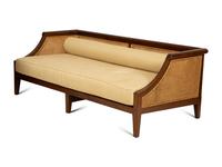 A Contemporary Walnut and Cane Daybed