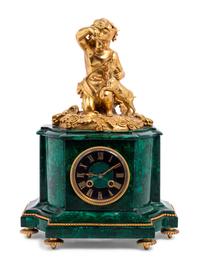 A Louis XVI Style Gilt Bronze and Malachite Veneered Mantel Clock