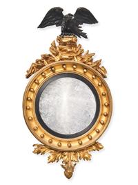 A Regency Giltwood and Part Ebonized Bull's Eye Mirror