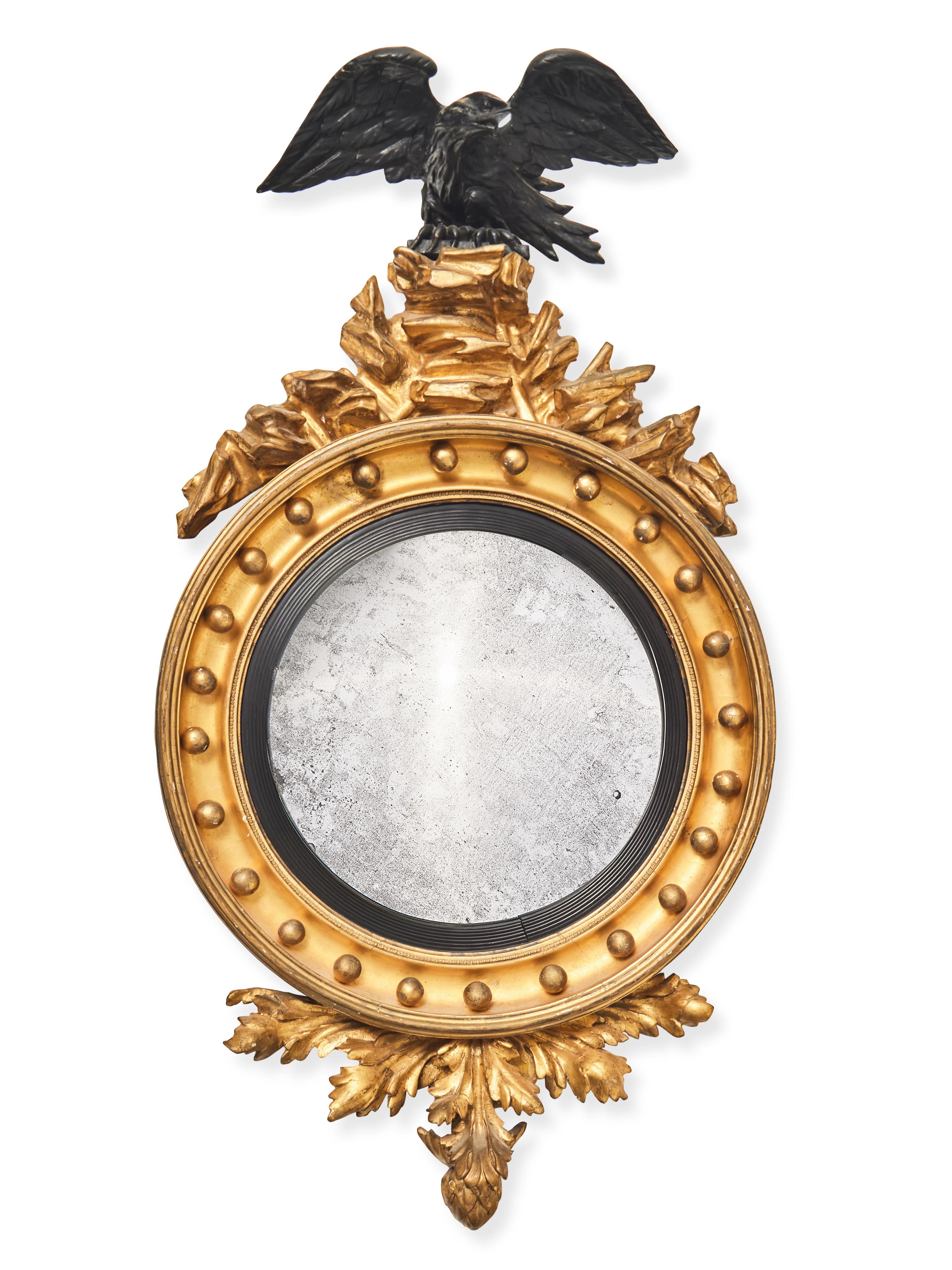 A Regency Giltwood and Part Ebonized Bull's Eye Mirror