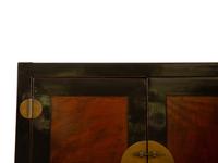 A Chinese Ming Style Black Lacquer and Elm Wood Cabinet