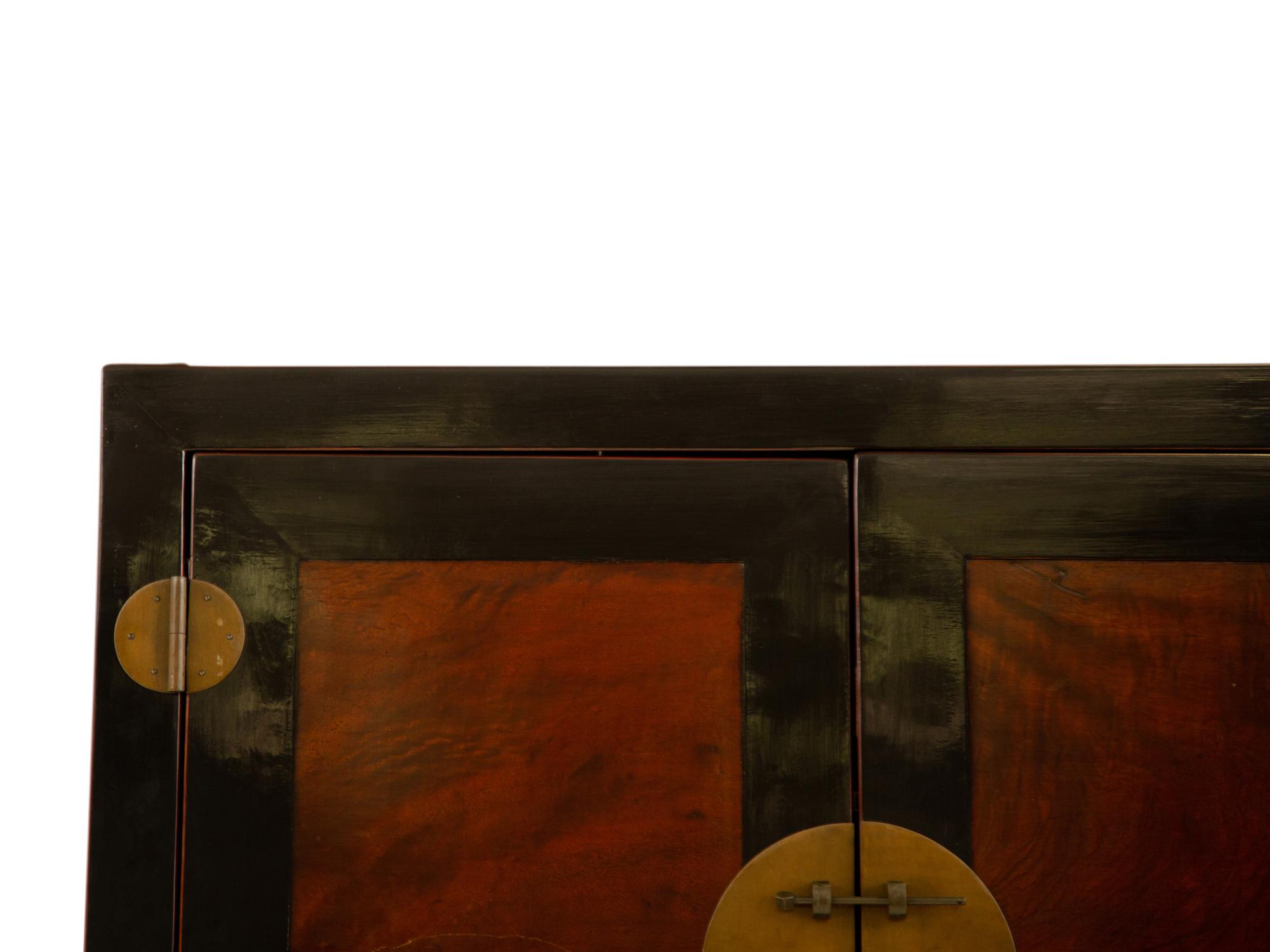 A Chinese Ming Style Black Lacquer and Elm Wood Cabinet