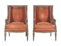 A Pair of Louis XVI Carved and Painted Walnut Bergères à L'Oreilles