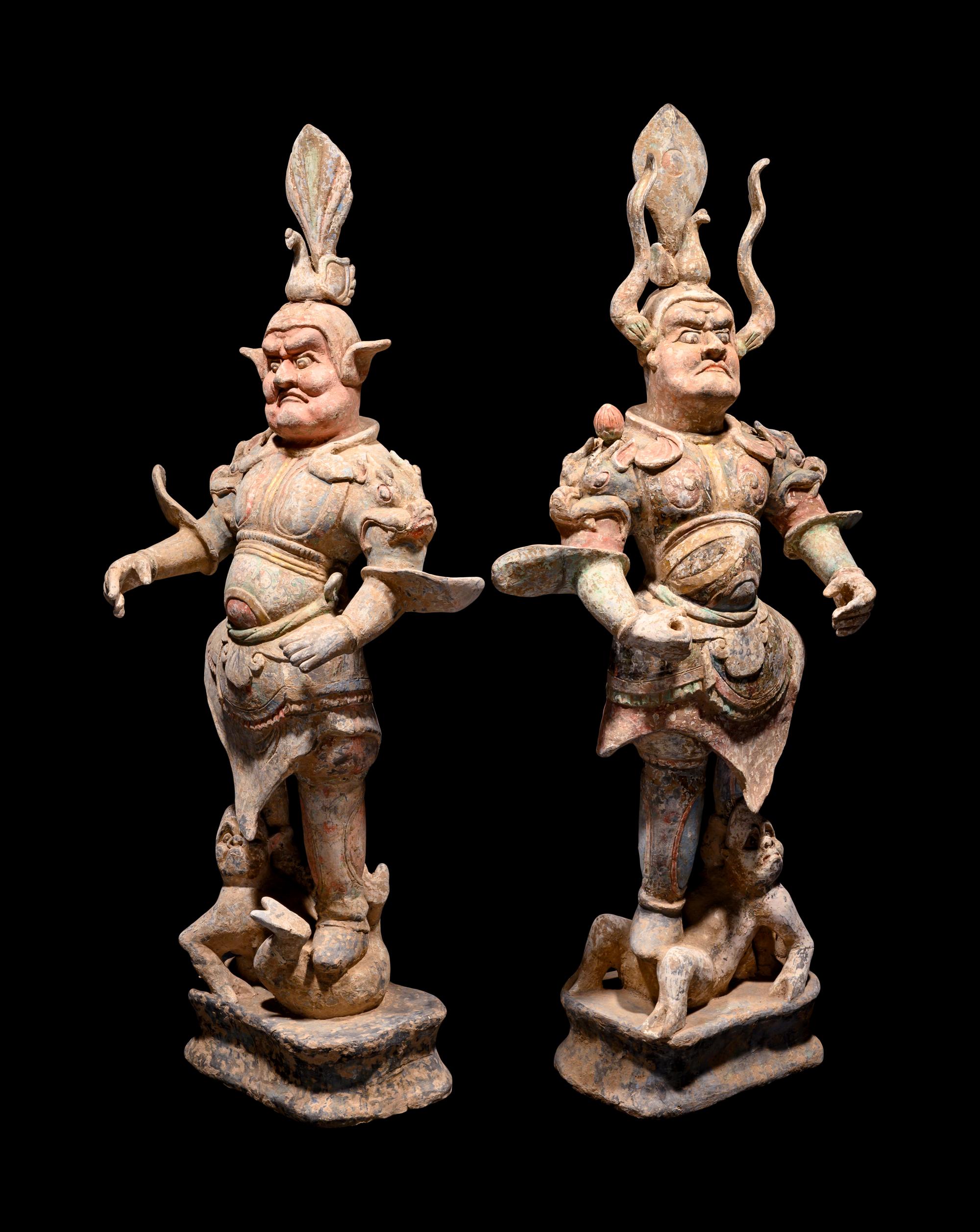 A Pair of Chinese Painted Pottery Figures of Guardians
