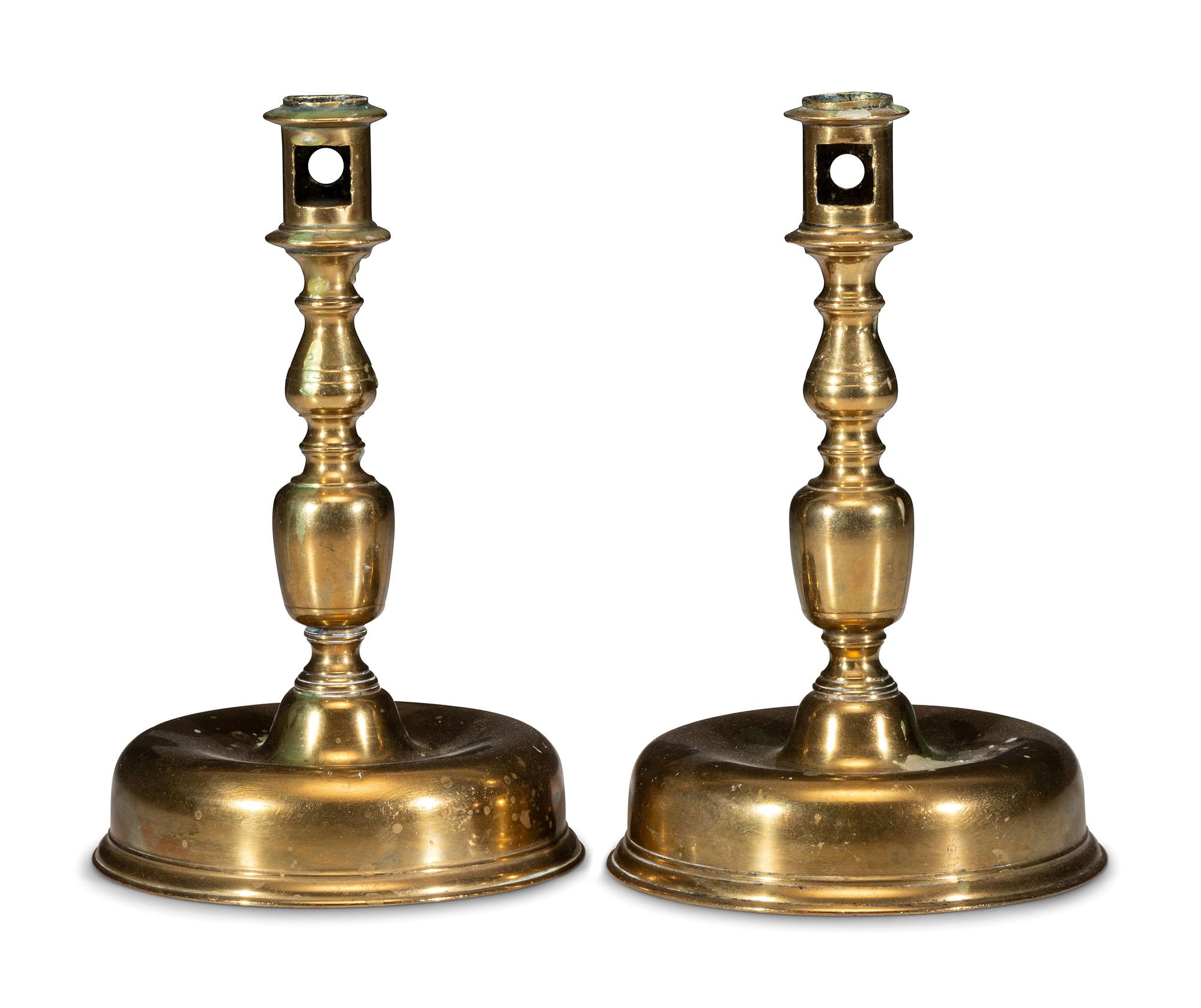 A Pair of Continental Brass Candlesticks