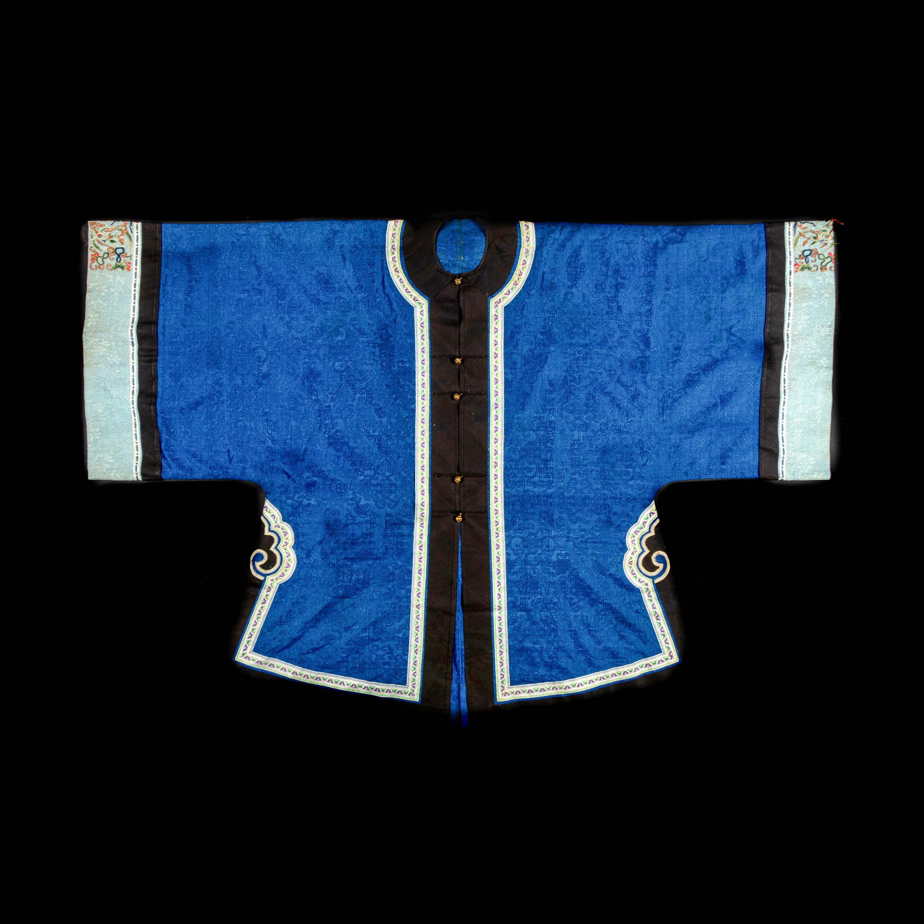 Two Chinese Blue Ground Silk Robes, Late Qing Dynasty 清晚期 藍地盤金繡游龍瑞獸纹道袍及藍地織錦女褂